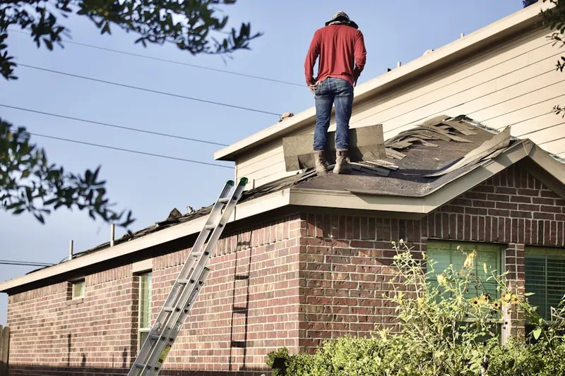 Professional roofer working on a residential roof in Crestline
